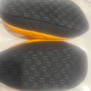 The North Face Orange and Black Slippers